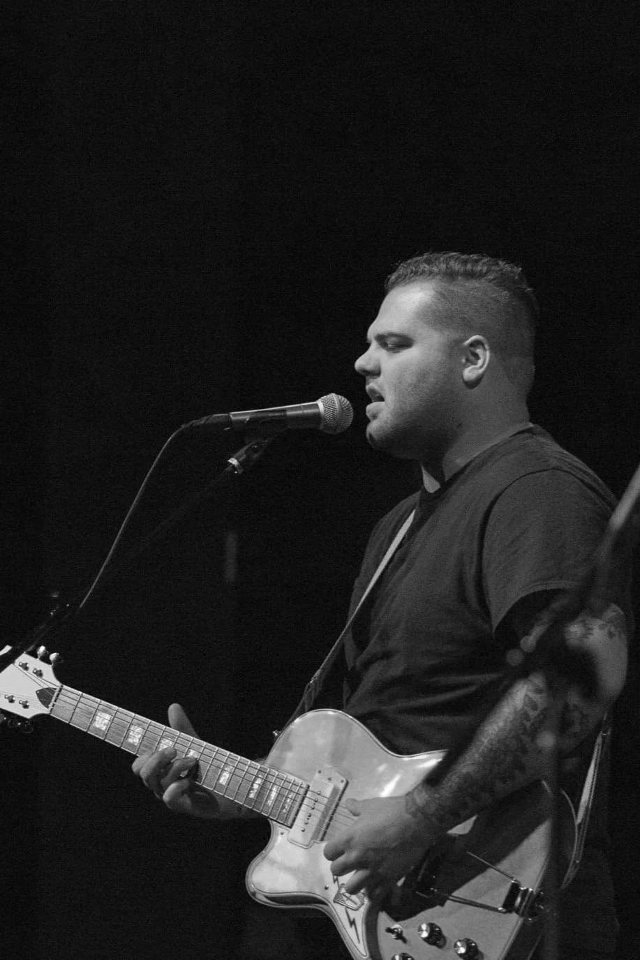 Taylor Anderson performing solo with guitar